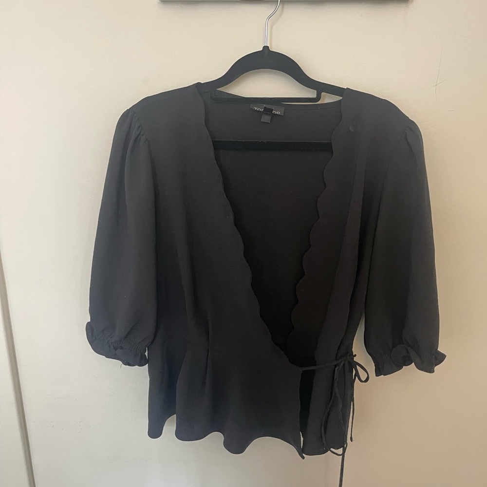 Wrap blouse with scalloped detail v-neckline and 3 quarter length sleeves